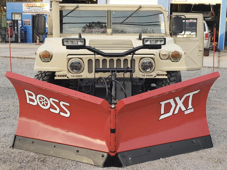 Boss snow plow installed on a Hummer